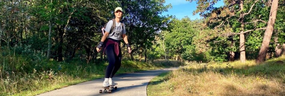 woman longboarding in zeeland